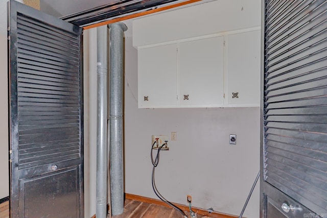 812 Glendale St, Jonesboro, AR 72401 - laundry room featuring hookup for an electric dryer, cabinet space, hookup for a washing machine, wood finished floors, and baseboards