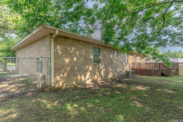 812 Glendale St, Jonesboro, AR 72401 - view of home's exterior featuring a deck, brick siding, a gate, central air condition unit, and stairs