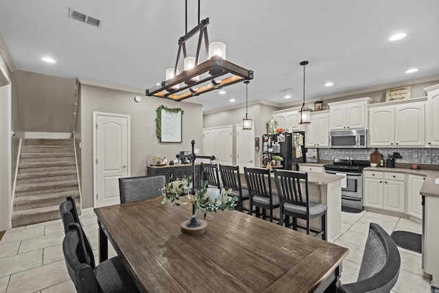 108 Chimney Rock Rd, Beebe, AR 72012 - dining area featuring recessed lighting, stairs, light tile patterned flooring, crown molding, and baseboards