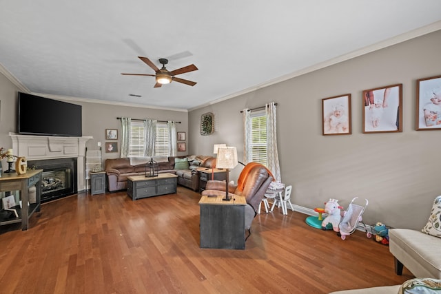 108 Chimney Rock Rd, Beebe, AR 72012 - living room with ceiling fan, wood finished floors, crown molding, a glass covered fireplace, and baseboards