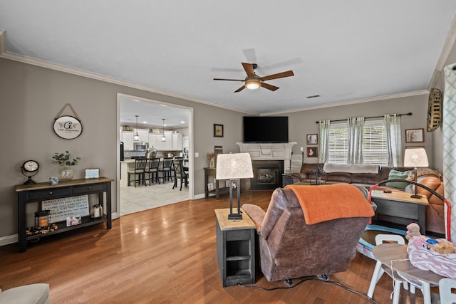 108 Chimney Rock Rd, Beebe, AR 72012 - living room with ceiling fan, wood finished floors, crown molding, a fireplace, and baseboards