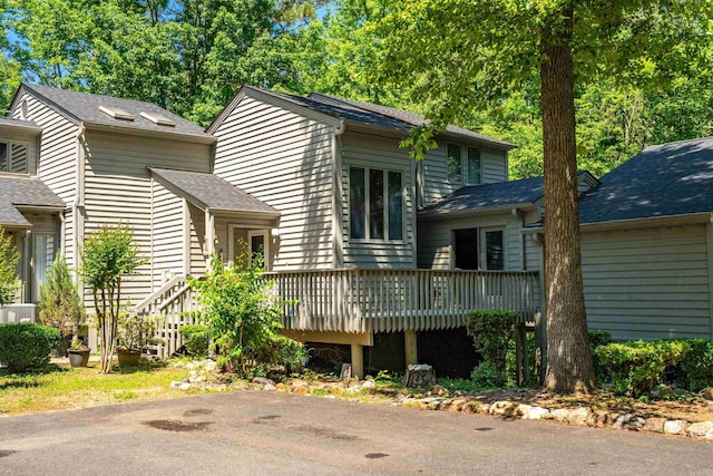 90 Silver Point Dr, Mount Ida, AR 71957 - split level home featuring a wooden deck and a shingled roof