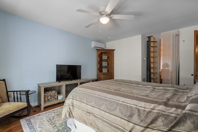 90 Silver Point Dr, Mount Ida, AR 71957 - bedroom featuring an AC wall unit, wood finished floors, baseboards, and a ceiling fan