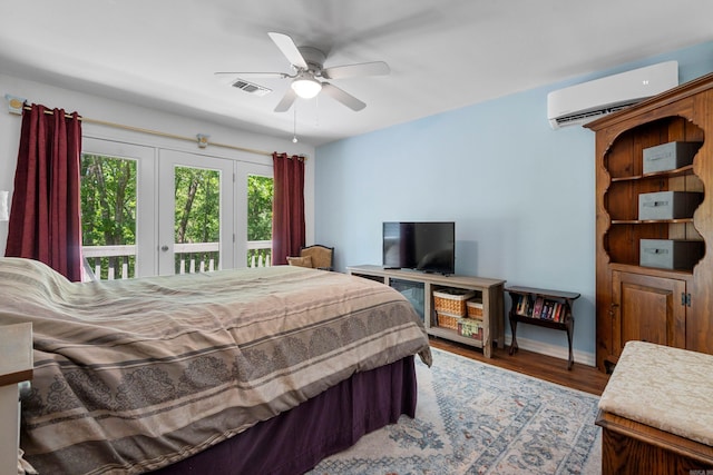 90 Silver Point Dr, Mount Ida, AR 71957 - bedroom with an AC wall unit, access to exterior, wood finished floors, baseboards, and a ceiling fan