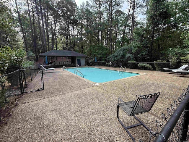 90 Silver Point Dr, Mount Ida, AR 71957 - community pool with a patio and an outbuilding