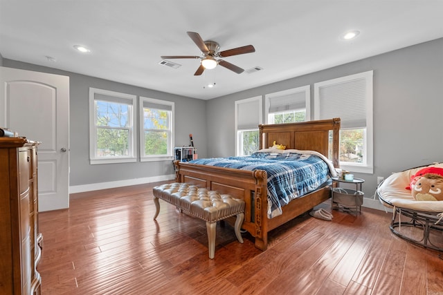 219 W D Ave, North Little Rock, AR 72116 - bedroom featuring baseboards, multiple windows, recessed lighting, wood finished floors, and a ceiling fan
