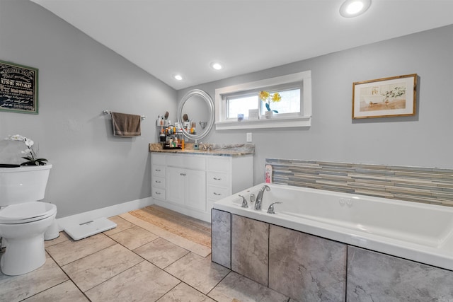 219 W D Ave, North Little Rock, AR 72116 - bathroom featuring vanity, a garden tub, toilet, and recessed lighting