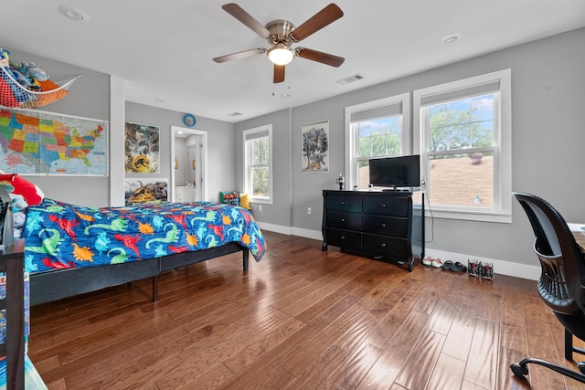 219 W D Ave, North Little Rock, AR 72116 - bedroom featuring baseboards, wood finished floors, a ceiling fan, and connected bathroom