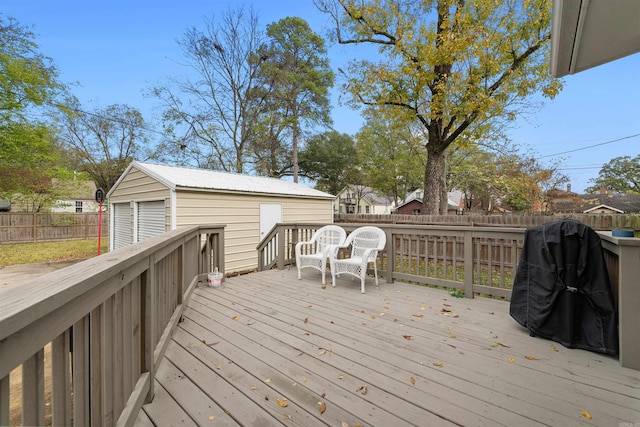 219 W D Ave, North Little Rock, AR 72116 - wooden deck with a fenced backyard and an outbuilding