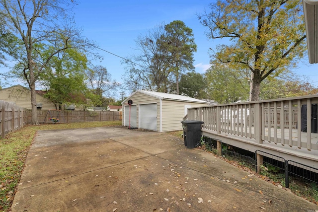 219 W D Ave, North Little Rock, AR 72116 - fenced backyard featuring a deck and an outdoor structure