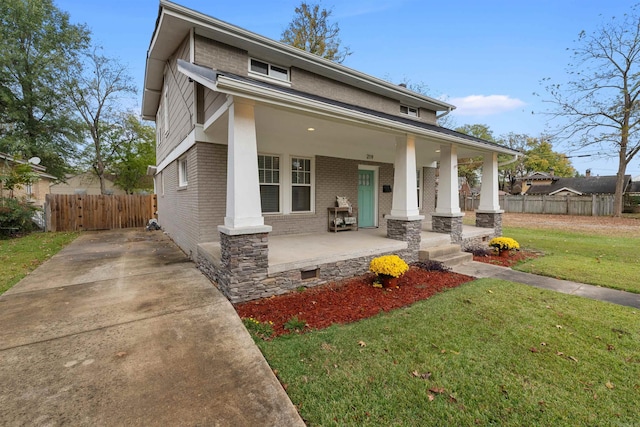 219 W D Ave, North Little Rock, AR 72116 - view of front facade with a porch and brick siding