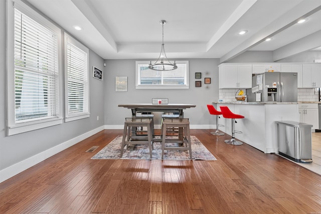 219 W D Ave, North Little Rock, AR 72116 - dining area featuring a tray ceiling, wood finished floors, baseboards, and recessed lighting