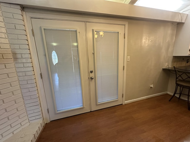 213 S Adcock, Dumas, AR 71639 - entrance foyer with wood finished floors, french doors, and baseboards