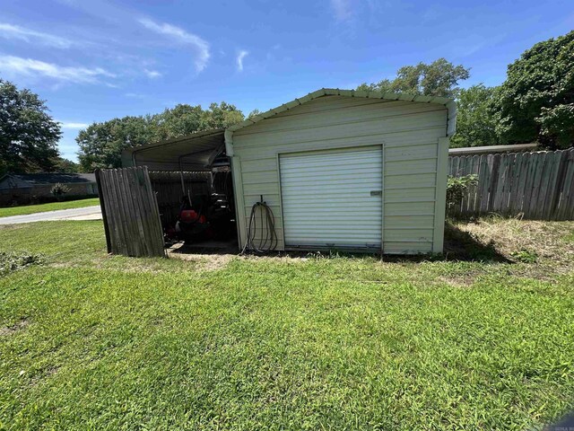 213 S Adcock, Dumas, AR 71639 - garage featuring a shed