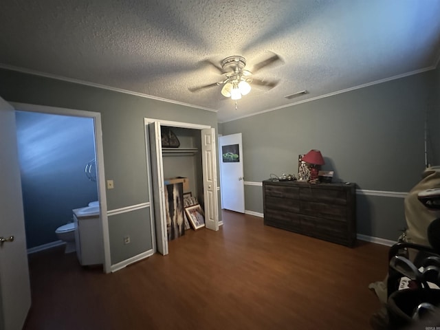213 S Adcock, Dumas, AR 71639 - bedroom featuring wood finished floors, crown molding, a closet, ceiling fan, and baseboards