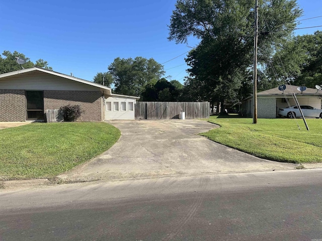 213 S Adcock, Dumas, AR 71639 - view of home's exterior with brick siding and driveway