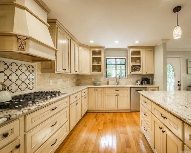 21221 Unicorn Ln, Roland, AR 72135 - kitchen featuring stainless steel appliances, ornamental molding, premium range hood, a sink, and pendant lighting