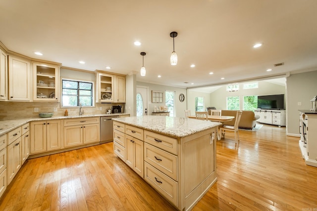 21221 Unicorn Ln, Roland, AR 72135 - kitchen featuring crown molding, a sink, light wood-style floors, glass insert cabinets, and stainless steel dishwasher