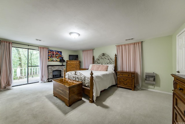 21221 Unicorn Ln, Roland, AR 72135 - bedroom with access to outside, carpet floors, heating unit, and baseboards