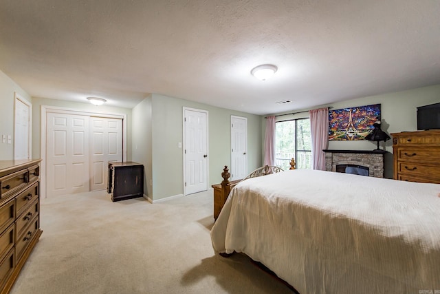 21221 Unicorn Ln, Roland, AR 72135 - bedroom featuring light colored carpet, baseboards, and a fireplace