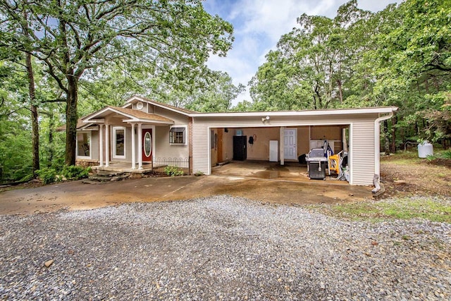 21221 Unicorn Ln, Roland, AR 72135 - view of front of home with an attached carport and gravel driveway