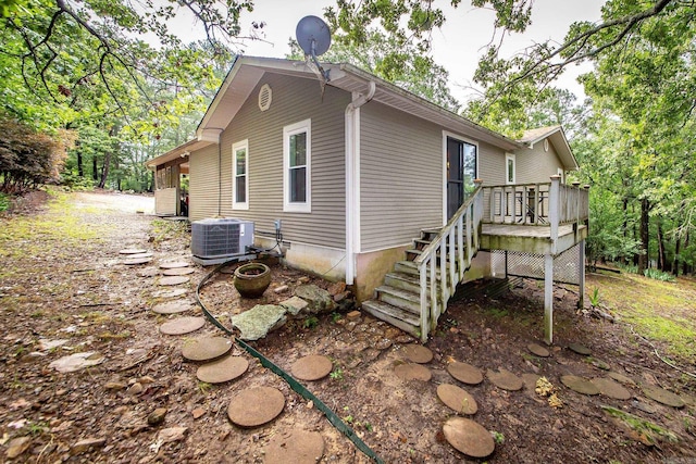21221 Unicorn Ln, Roland, AR 72135 - view of home's exterior with central air condition unit and a deck