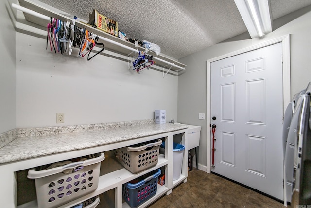 21221 Unicorn Ln, Roland, AR 72135 - laundry area featuring a textured ceiling