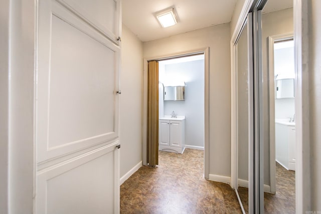 21221 Unicorn Ln, Roland, AR 72135 - hallway featuring a sink and baseboards