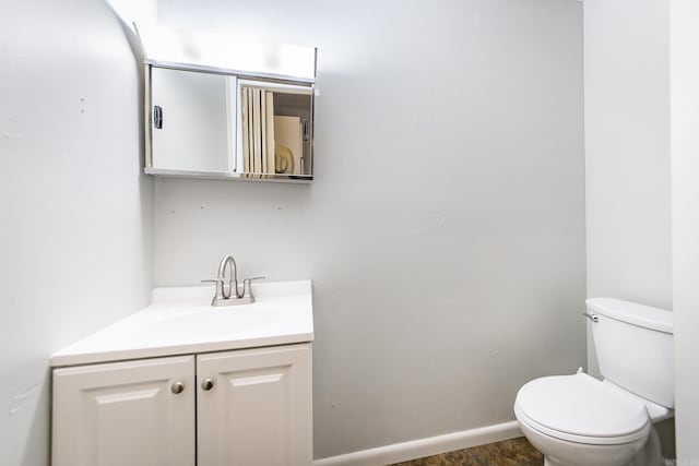 21221 Unicorn Ln, Roland, AR 72135 - half bathroom featuring vanity, toilet, and baseboards