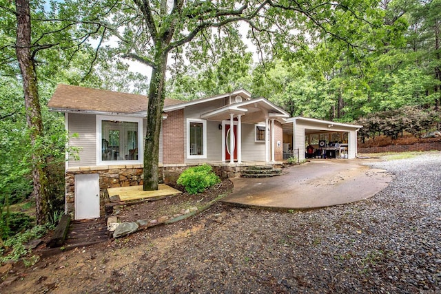 21221 Unicorn Ln, Roland, AR 72135 - view of front of home with covered porch and a carport