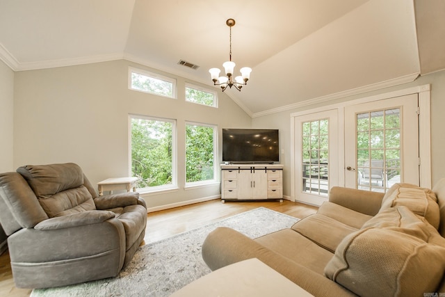 21221 Unicorn Ln, Roland, AR 72135 - living room featuring a chandelier, light wood finished floors, vaulted ceiling, and crown molding