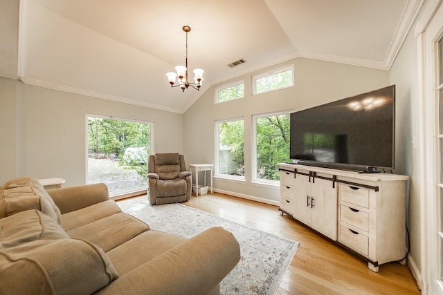21221 Unicorn Ln, Roland, AR 72135 - living room featuring lofted ceiling, crown molding, a chandelier, and light wood-type flooring