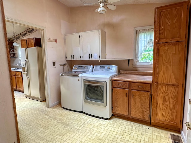 33 W Lakeshore Dr, Cherokee Village, AR 72529 - laundry area with cabinet space, brick patterned floors, a ceiling fan, and washing machine and clothes dryer