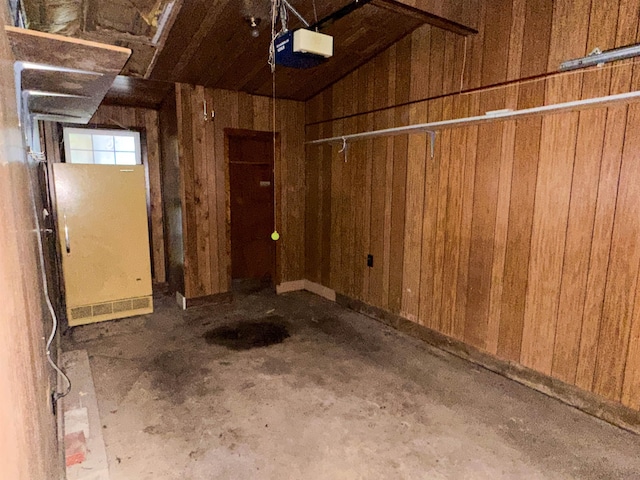 33 W Lakeshore Dr, Cherokee Village, AR 72529 - garage with wood walls and a garage door opener