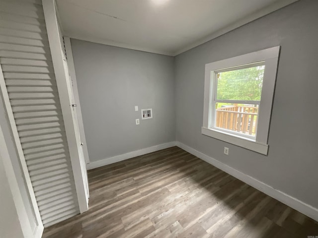 301 W Frazior, Linden, TX 75563 - spare room with baseboards and wood finished floors
