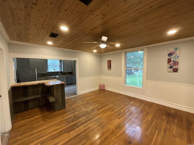 301 W Frazior, Linden, TX 75563 - kitchen with freestanding refrigerator, ornamental molding, ceiling fan, dark wood finished floors, and wooden ceiling