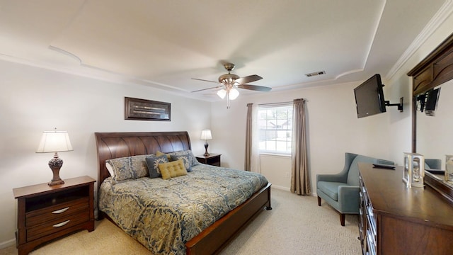bedroom featuring light carpet, crown molding, and a ceiling fan