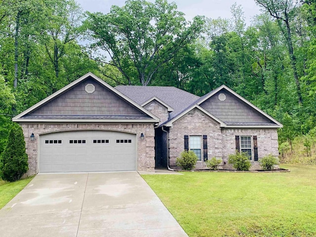 3008 Lilly Ln, Benton, AR 72019 - view of front of home featuring brick siding, concrete driveway, a garage, and a front lawn