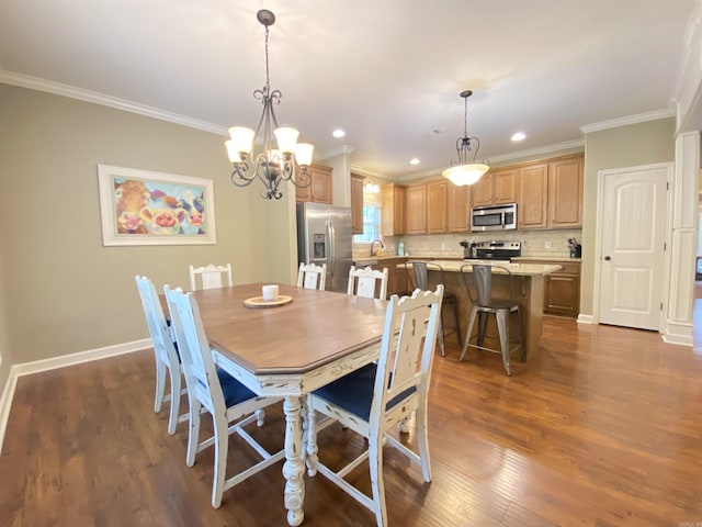 3008 Lilly Ln, Benton, AR 72019 - dining area featuring ornamental molding, dark wood-type flooring, baseboards, a chandelier, and recessed lighting