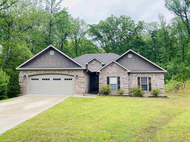 3008 Lilly Ln, Benton, AR 72019 - view of front of home featuring an attached garage, concrete driveway, a front yard, and brick siding