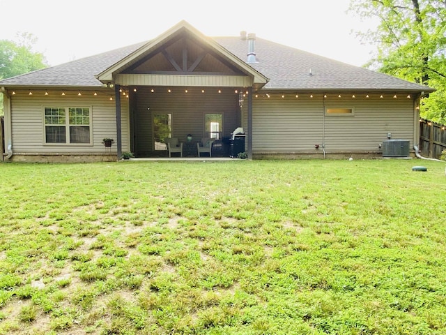 3008 Lilly Ln, Benton, AR 72019 - back of house featuring central air condition unit, a shingled roof, and a patio