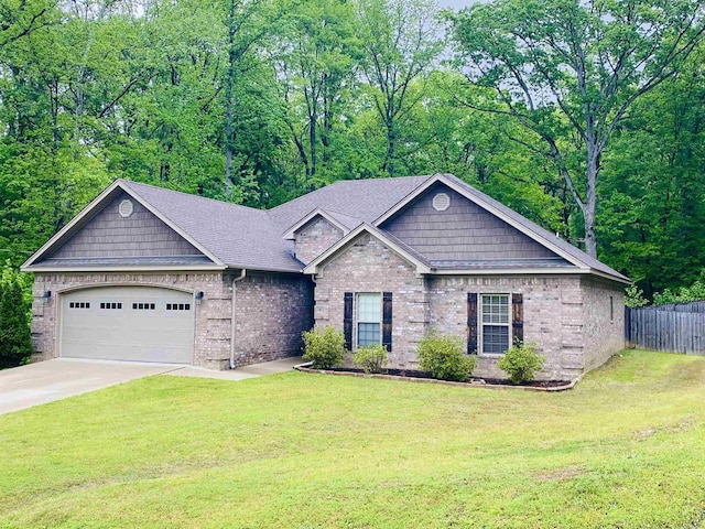 3008 Lilly Ln, Benton, AR 72019 - view of front of house featuring a garage, concrete driveway, brick siding, and a shingled roof