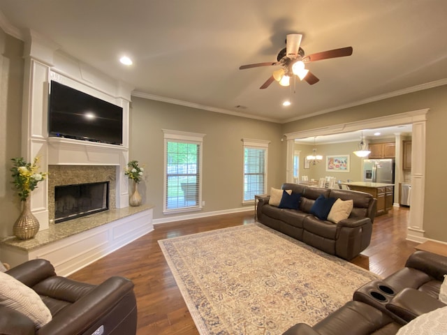 3008 Lilly Ln, Benton, AR 72019 - living area with a ceiling fan, a premium fireplace, ornamental molding, dark wood-style flooring, and baseboards