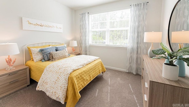 bedroom with carpet and baseboards
