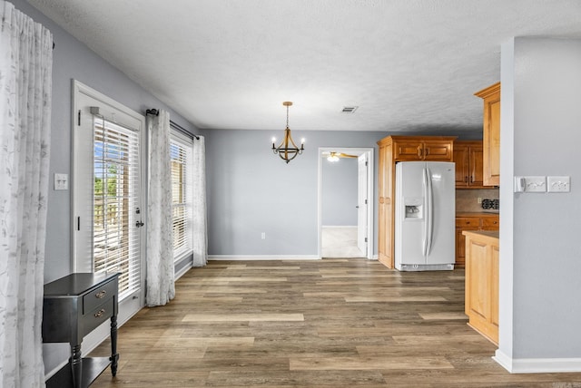 40 Pine Mountain Dr, Conway, AR 72034 - unfurnished dining area featuring a chandelier, wood finished floors, and baseboards