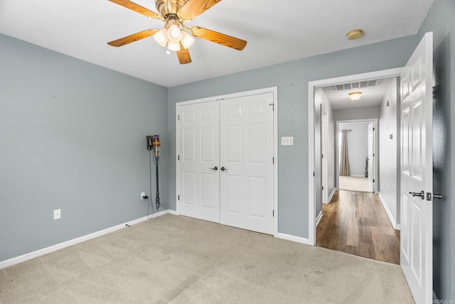40 Pine Mountain Dr, Conway, AR 72034 - unfurnished bedroom with carpet flooring, baseboards, a closet, and ceiling fan