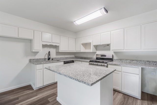 612 Briar St, Sherwood, AR 72120 - kitchen featuring gas range, a sink, white cabinetry, a center island, and light stone countertops