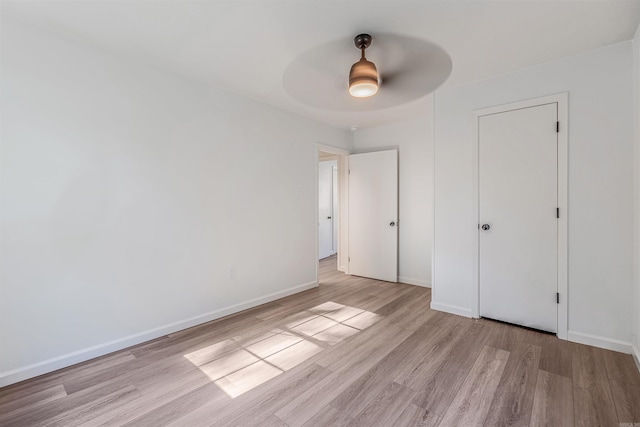612 Briar St, Sherwood, AR 72120 - unfurnished bedroom with wood finished floors, baseboards, and a ceiling fan
