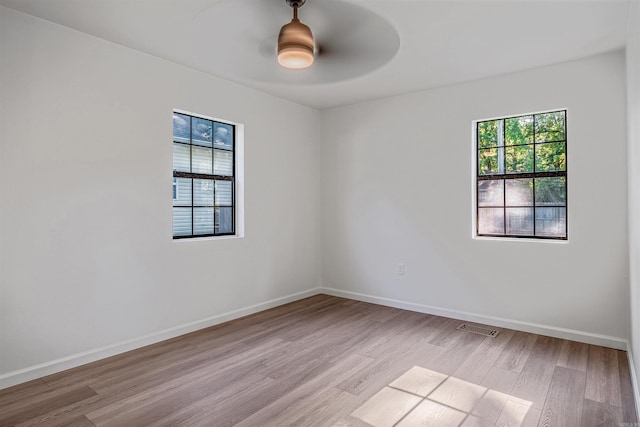 612 Briar St, Sherwood, AR 72120 - unfurnished room featuring light wood-type flooring, a ceiling fan, and baseboards