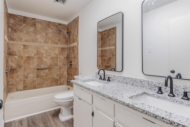 612 Briar St, Sherwood, AR 72120 - full bathroom featuring double vanity, wood finished floors, shower / bath combination, and toilet